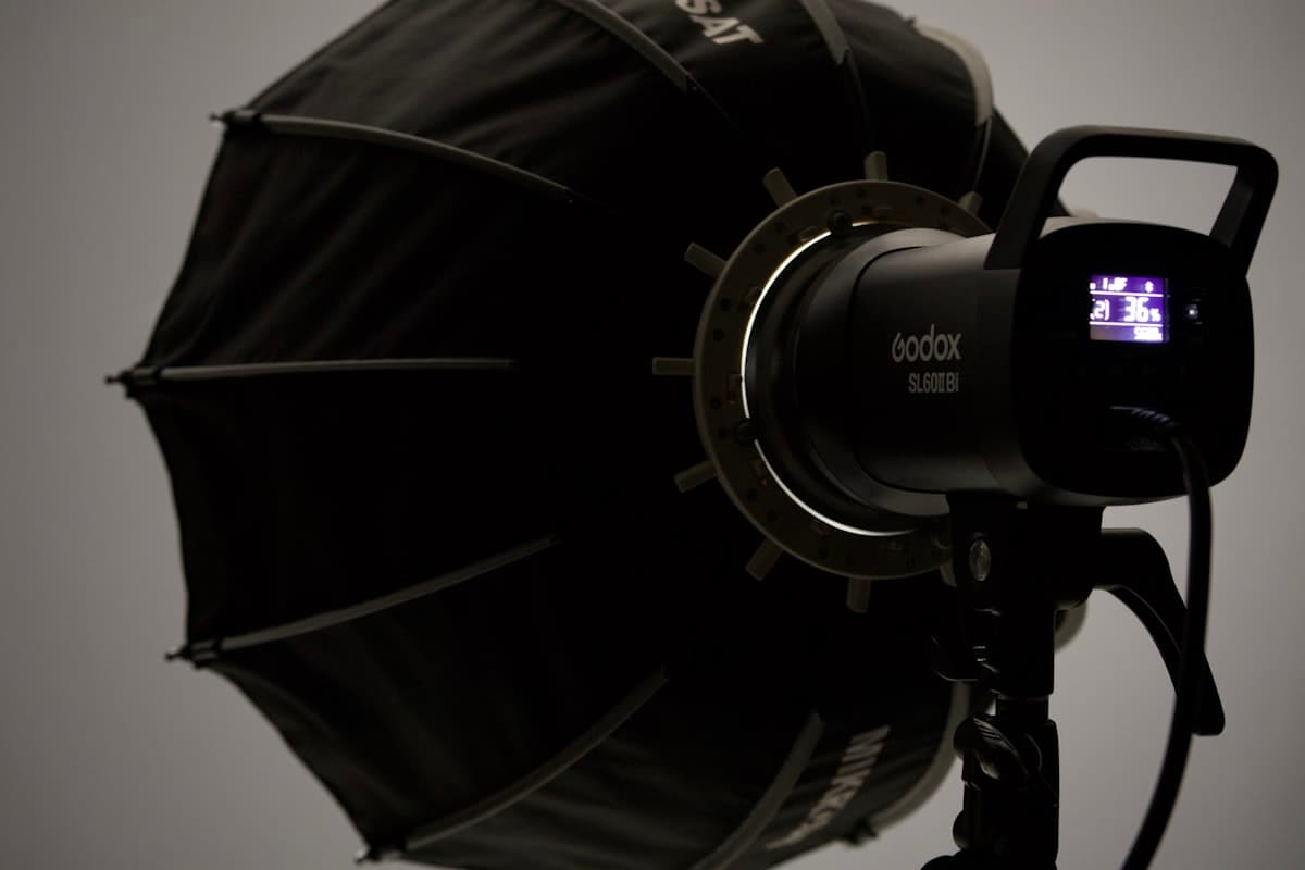 A parabolic soft box mounted on a studio strobe head