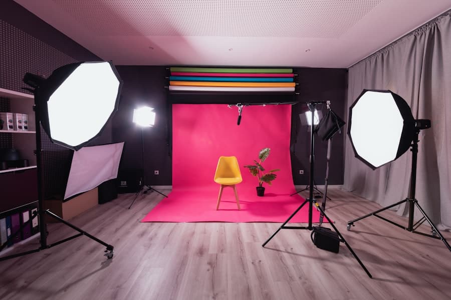A studio set with a coloured paper backdrop and a chair