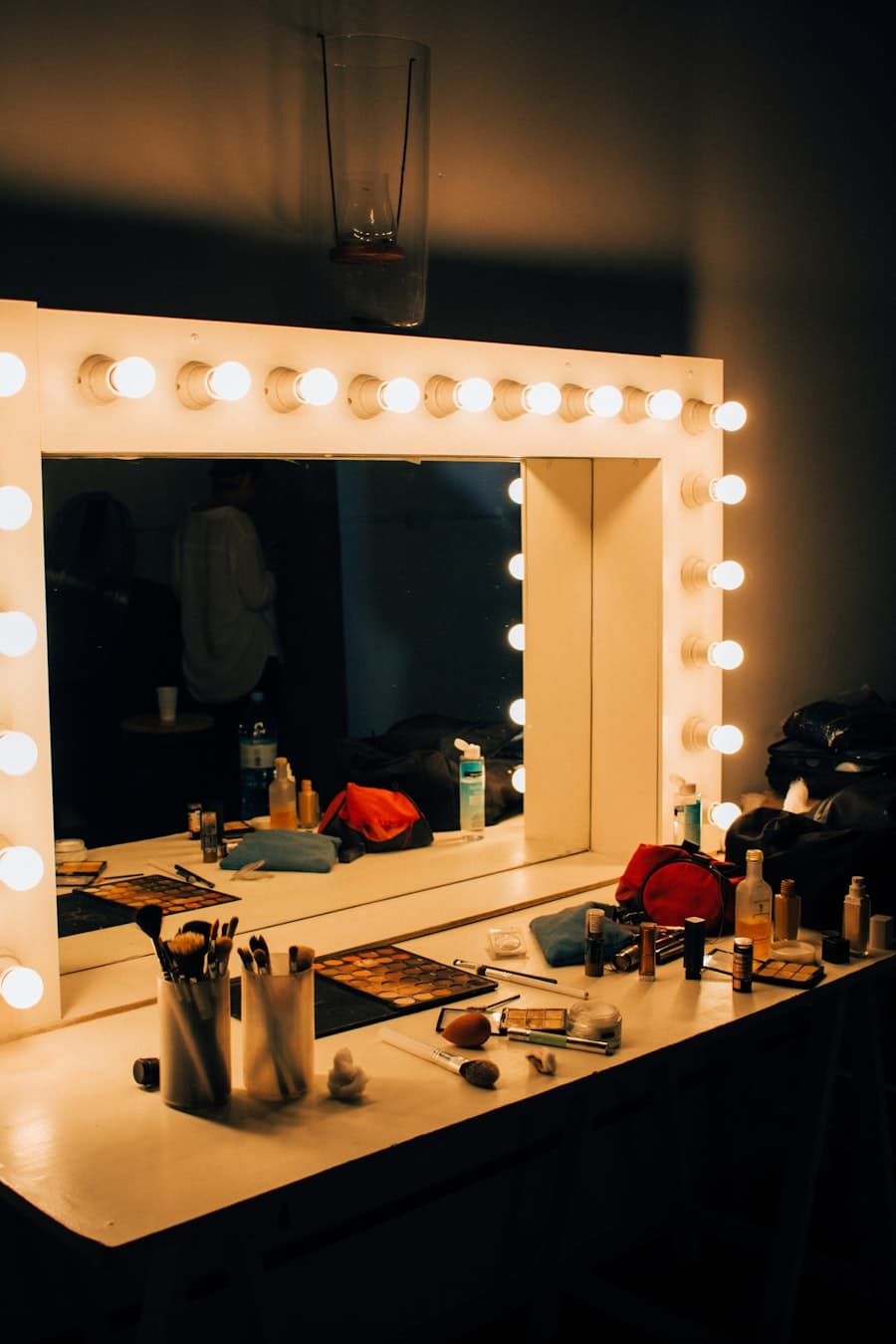 A bulb-lit makeup station ready for a session